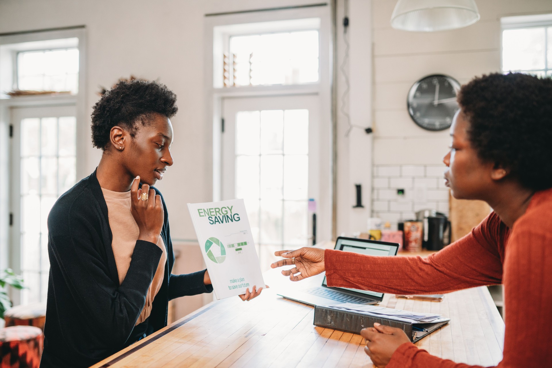 A personal financial advisor is explaining new strategies to a customer